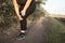 Woman got a knee trauma at outdoor jogging