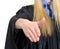 Woman in graduation gown stretching hand for handshake