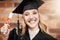 Woman, graduation and portrait of a university student with a diploma and smile on face. Female person excited to