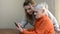 Woman granddaughter teaches her elderly grandmother to use a smartphone