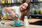 Woman with granola breakfast in the kitchen