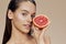 woman grapefruit in hands smile vitamins isolated background