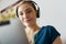 Woman With Green Earphones Listens Podcast Music On Tablet