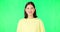 Woman, green screen and face with happy wink for funny gesture, flirting or secret in studio mock up. Girl, portrait or