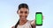 Woman, green screen and mobile in mockup with fitness, happy or advertising on announcement in portrait. Indian model