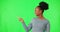Woman, green screen and presentation, thumbs up or pointing to information, list and steps mockup in studio. Face of