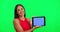 Woman, green screen and tablet with face, ux or mockup space for logo, branding and review with smile. Girl, model or