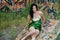Woman in Green Sequined Dress and Graffiti