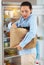 Woman, groceries and bag for packing in fridge with idea for organization of food, fruit or vegetables for diet. Female