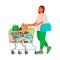 Woman with a grocery cart in the supermarket. Buying food. Customer at a retail grocery store