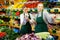 Woman grocery store owner giving instructions to young salesgirl