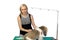 Woman-groomer brushing fluffy shih tzu on white