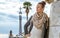 Woman at Guell Park in Barcelona, Spain looking into distance