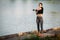 Woman gym in park. Fitness in nature. Morning exercise with beautiful, sport woman. Girl doing workout in Park stretches hand