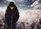 Woman hacker hooded standing on in front of digital background