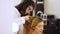 The woman the hairdresser does a hair for a professional photoshoot of the girl of model.