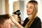 Woman Hairdresser Drying Male Hair with Hairdryer