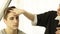 Woman hairstylist making male hairstyle in hairdressing salon. Close up barber doing male hairdo during working with