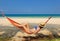 Woman in hammock on beach