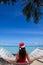 Woman in hammock celebrating Christmas