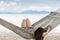 Woman in a hammock on a tropical beach in summer vacation.