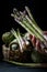 Woman hand with asparagus on textured background with artichokes in a basket 2