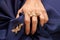 Woman hand with beautiful gold ring with precious gemstone
