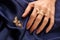 Woman hand with beautiful gold ring with precious gemstone