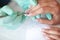 Woman Hand Care. Closeup Of Beautiful Female Hands Having Spa Manicure At Beauty Salon. Beautician Filing Clients