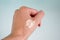 Woman hand with cosmetic foundation or concealer swatches against white background, closeup.