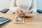 Woman hand counting Japanese Yen banknote with calculator. Thousand Yen money. Japan cash, Tax, Recession Economy, Inflation,