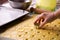 Woman hand cutting the dough for canestrelli biscuits shape