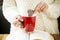 Woman Hand Dipping Cookie in Tea