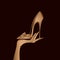 Woman hand, elegant stiletto shoe. Fashion logo. Gold color gloves.