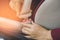 Woman hand fastening a seat belt before driving