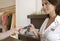 Woman hand Handing Credit Card at Counter