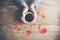 Woman hand  hearts and coffee on table background