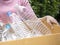 Woman hand holdging box of plastic bottle garbage for recycle