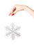 Woman hand holding big holiday snowflake