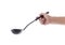 Woman hand holding black ladle dipper isolated