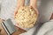 Woman hand holding bread dough with cranberry