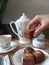 A woman hand holding a chocolate nut cake