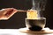 Woman hand holding chopsticks of instant noodles in cup with smoke rising dark background, Sodium diet high risk kidney