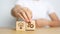 Woman hand holding dartboard above Gear, magnifying and Lightbulb icon block. business planning process, goal, strategy, target,