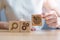 Woman hand holding dartboard, Gear and Lightbulb icon block on table. business planning process, goal, strategy, target, mission,