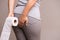 Woman hand holding her bottom and tissue or toilet paper roll. Disorder, Diarrhea, Constipation. Healthcare concept