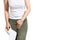 Woman hand holding her crotch lower abdomen and tissue or toilet paper roll