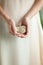 Woman hand holding little fossile ammonite, sensual studio shot with soft light