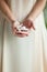 Woman hand holding little sea shell, sensual studio shot with soft light