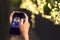 Woman Hand holding mobile with Happy new year 2018 fireworks over cityscape on screen with light